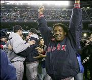 Boston pitcher Pedro Martinez celebrates with teammates after the
Red Sox beat the New York Yankees in Game 7 of the AL championship
series. Boston won, 10-3, Wednesday in New York to complete a
comeback from an 0-3 series deficit.