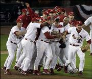 St. Louis' Scott Rolen (27), who hit a two-run home run in the
sixth inning, leads his teammates in celebration after their 5-2
victory over Houston. The Cardinals won Game 7 and the NL
championship series Thursday night at Busch Stadium in St. Louis.
They will face the Boston Red Sox in the World Series.