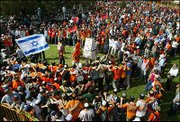 Thousands of supporters of the Jewish settlement movement gather in
front of Israel's parliament to protest Prime Minister Ariel
Sharon's plan to withdraw from the Gaza Strip. Sharon made a final
break with his former allies in the settler movement Tuesday, and
the Knesset approved a plan for withdrawal from the Gaza Strip and
parts of the West Bank.