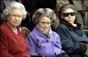 Britain's Queen Elizabeth, left, joins her aunt, Princess Alice,
center, and sister Princess Margaret on Princess Alice's 100th
birthday, Dec. 12, 2001. Alice, the Dowager Duchess of Gloucester,
died Friday at 102.