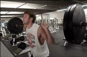 John Lammli, a Kansas University senior from Lawrence, works out at
the Lawrence Athletic Club's south location, 2108 W. 27th St. Rick
Sells, the club's owner, said he plans to close the center on Dec.
1.