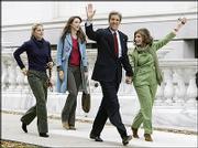 Democratic presidential candidate Sen. John Kerry, left photo, and
his wife, Teresa Heinz Kerry, arrive at the Statehouse in Boston
where Sen. Kerry cast his vote Tuesday.
