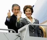 President Bush gives a thumbs-up as he and first lady Laura Bush
board Air Force One in Waco, Texas. Bush voted Tuesday morning in
Crawford, Texas.