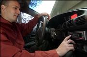Steve Vukelich is one of a growing number of satellite radio
subscribers in Lawrence. Vukelich has a Sirius system installed in
his car.
