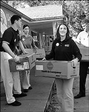 Capitol Federal Savings employees deliver food to Penn House during
the United Way of Douglas County's Fall Day of Caring. From left
are Travis Sullivan, Jenn Oehlert, Jaime Sauer and Nathan Oehlert.
They volunteered Sept. 24.