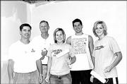 Central National Bank employees paint walls at Van Go Mobile Arts
during the United Way of Douglas County's Fall Day of Caring. From
left are Rob Gillespie, Tom Koemig, Adele Bisel, Mark Sedlak and
Amanda Vail. They helped the nonprofit organization on Sept. 24.