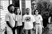 Pearson Government Solutions employees, from left, Anthony Case,
Rachelle Lee, Alex Louis and Diana Hirahoka volunteer their time to
clean the back yard of a Visiting Nurses Assn. client's home. They
participated in the United Way of Douglas County's Fall Day of
Caring on Sept. 24.