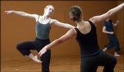 Bowery Dancers Ellie Goudie-Averill, left, and Christine Scott
rehearse for their Thursday performance at Liberty Hall. Company
member Michael Ingle, background, waits in the wings.