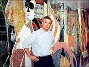 Stephen Johnson has won the Phoenix Award for Exceptional Artistic
Achievement. He is pictured in front of the glass mosaic mural he
created for a subway station in Brooklyn, N.Y.