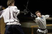 Cast members of University Theatre's upcoming production of "Romeo
and Juliet" fine tune their sword-fighting skills for a brawl
scene. The play opens Friday at Crafton-Preyer Theatre.