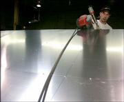 Metal craftsman Brian Jackson fabricates a roof panel destined for
the Hunter Museum of American Art in Chattanooga, Tenn. He worked
on the project Oct. 4 at A. Zahner Co.'s headquarters in Kansas
City, Mo.