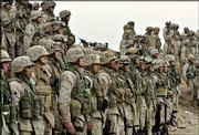 U.S. Marines of the 1st Division line up for a prayer Saturday at
their base outside Fallujah, Iraq. More than 10,000 U.S. troops
have taken positions around the rebel-controlled city of Fallujah,
bolstering the U.S. Marine units expected to lead a joint
Army-Marine assault on the city.