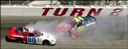 Andy Hillenburg, car No. 80, and Jeff Gordon, car No. 24, collide
in Turn 2 of the 2004 Carolina Dodge Dealers 400 at Darlington
Raceway. The South Carolina track has a reputation of being
difficult because of its unique egg shape, tight corners and rough
surface.