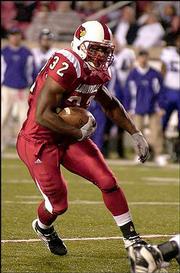 Louisville running back Eric Shelton breaks off a long run in the
Cardinals' 55-28 rout of TCU. The 12th-ranked Cards jumped to a big
early lead and rolled to the victory Wednesday at Papa John's
Cardinal Stadium in Louisville, Ky.