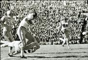 An unidentified Kansas defender tries to tackle Missouri running
back Donnie Smith (45) during the 1960 game.