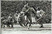 Kansas fullback Doyle schick (30) carries the ball during the
Jayhawks' stunning 23-7 win over previously unbeaten Missouri in
1960. MU was later awarded a forfeit victory when KU running back
Bert Coan was declared ineligible.