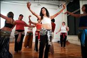Jamileh Jeanne Handy leads a belly dancing for fitness class in
Brunswick, Maine. The ancient form of dance has begun to appear in
more health clubs.