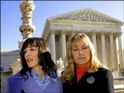 Angel Raich, left, of Oakland, Calif., and Diane Monson, from near
Oroville, Calif., leave the U.S. Supreme Court in Washington after
the justices heard arguments on their medicinal use of marijuana.
Raich, who suffers from an inoperable brain tumor and scoliosis,
and Monson, who has a degenerative spine disease, pleaded to the
court that they are law-abiding citizens who are seriously ill and
need marijuana to survive the pain of their health problems.