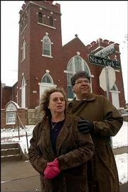 Denise Low and her husband T.F. Pecore Weso have co-authored a book
that documents just about every place in the city that was
significant to Langston Hughes. They're pictured Tuesday in front
of St. Luke AME church, 900 N.Y., the church Hughes attended as a
child.