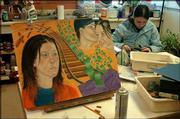 Lawrence Alternative High School senior Becky Wehner, 18, works on
an art project for this year's art show. LAHS will close, and its
students will be integrated into the two Lawrence public high
schools next year. Supt. Randy Weseman said the LAHS program was
not working.