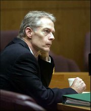 Defendant Thomas E. Murray listens Thursday as prosecutors present
a list of Internet searches that Murray allegedly made on his
computer.