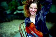 Three-time U.S. Scottish fiddle champion Bonnie Rideout and a
troupe of Celtic musicians performed "A Scottish Christmas" Friday
evening at the Lied Center.