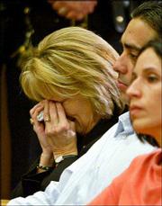 Laci's mother, Sharon Rocha, left, and Brent and Rose Marie Mocha,
appear at a news conference after the verdict.