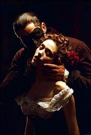 The Phantom (Gerard Butler) embraces Christine (Emmy Rossum) in the
musical drama "Andrew Lloyd Webber&squot;s The Phantom of the Opera."