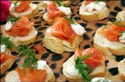Smoked Salmon on Toasted Rye rounds with dilled cream cheese and
sour cream is a creation of Alice&squot;s Key West chef-owner Alice
Weingarten. She suggests serving the canapes with champagne for a
party following a theme of "Bubbles and Bites."