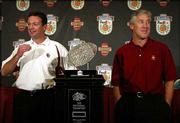 Oklahoma coach Bob Stoops, left, poses next to the Bowl
Championship Series trophy with Southern California coach Pete
Carroll. The two coaches attended a news conference Monday in Ft.
Lauderdale, Fla., to discuss the Orange Bowl, which will serve as
the BCS Championship game, between the Sooners and Trojans tonight
in Miami.