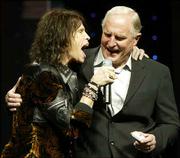 Steven Tyler, left, of Aerosmith, sings with Craig Barrett, CEO of
Intel, as Barrett delivers the keynote address of the Consumer
Electronics Show in Las Vegas.