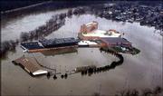 The Wheeling Island Racetrack and Gaming Center is engulfed by
water from the Ohio River in Wheeling, W.Va. Flooding along the
Ohio damaged hundreds of homes and businesses in Ohio and West
Virginia, and water is not expected to recede until this afternoon.