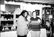 Mother to Mother of Douglas County board members Ruby McDavis and
Danita Long attend a tea at Centenary United Methodist Church.
Participants toured a nativity display and enjoyed treats at the
Dec. 5 event. There also was a program and visit from Santa.