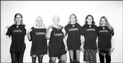 Lawrence High School varsity gymnasts show off their state champion
T-shirts. LHS Principal Steve Nilhas presented them during a
banquet Dec. 5. From left are Jessica Williams, Meredith West, head
coach Kathy Johnson, Chelsey Ornburn, Kara Kellison and Mallory
West.
