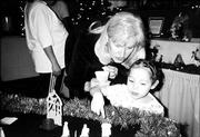 Barbara Hillmer looks at a nativity scene with Xiannah Washburn.
They attended a Mother to Mother Tea on Dec. 5 at Centenary United
Methodist Church.