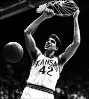 Kansas University center Mark Randall scores on one of many
breakaway dunks during a game against Kentucky. The Jayhawks beat
the Wildcats, 150-95, on Dec. 9, 1989 at Allen Fieldhouse, scoring
the most points in KU history.<br>
<a href=
"http://etc.lawrence.com/galleries/kuky1989/6924_lores.html"
target="_new" onclick=
"window.open(&squot;http://etc.lawrence.com/galleries/kuky1989/6924_lores.html&squot;,&squot;Photo&squot;,&squot;height=650,width=550,screenX=10,screenY=10,&squot; + &squot;scrollbars,resizable&squot;); return false;">
<img src="http://www.ljworld.com/art/icons/icon_photo.gif" border=
"0" alt="photo"> Photo Gallery: KU vs. Kentucky: Dec. 9,
1989</a><br>
