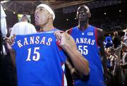 Kansas University's J.R. Giddens (15) and Moulaye Niang run into
the tunnel as they celebrate the Jayhawks' victory over Kentucky in
front of Rupp Arena fans. The Jayhawks won, 65-59, at the venerable
venue Sunday in Lexington, Ky.
