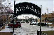 The owner of Abe & Jake's Landing, Mike Elwell, wants to
renegotiate his parking contract with the city of Lawrence. Elwell
now pays $4,800 a year so that patrons may park for free in the
city-owned garage and parking deck outside the bar at Sixth and New
Hampshire streets.