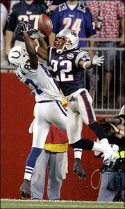 New England cornerback Asante Samuel (22) breaks up a pass intended
for Indianapolis receiver Reggie Wayne in a game earlier this
season. The Patriots beat the Colts on Sept. 9 in Foxboro, Mass.,
and the two teams will play again there Sunday.