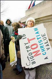 Debbie Wadman, Wichita, and hundreds of other protesters converged
on the Statehouse to protest a proposed same-sex marriage
amendment. Republican legislative leaders announced Monday they
plan to have the Senate vote this week.