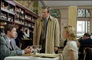 Dan Foreman (Dennis Quaid), standing, discovers his boss, Carter
Duryea (Topher Grace), lunching with his daughter, Alex (Scarlett
Johansson), in "In Good Company," a comedy from writer/director
Paul Weitz.