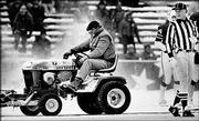 Mark Henderson, a convicted burglar on work release from the
Massachusetts Correctional Institution in Norfolk, Mass., clears
snow in this file photo from Dec. 12, 1982, at Schaefer Stadium in
Foxboro, Mass. Henderson was involved in a controversial play in
the fourth quarter when he plowed an area where the Patriots&squot; John
Smith kicked the winning field goal in the "Snow Plow Game."