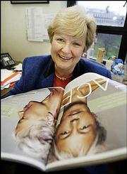 Washington state Sen. Karen Keiser looks over a magazine touting
the latest trends in cosmetic surgery in her office at the Capitol
in Olympia, Wash. Keiser has proposed a "vanity tax" on cosmetic
surgery. She wants to earmark the money for poor children&squot;s health
insurance.