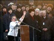 Merka Szevach shows her tattoo with her Auschwitz inmate number as
she speaks in front of the memorial in the former Nazi
concentration camp of Auschwitz. About 2,000 aging survivors of
Auschwitz -- still bearing Nazi-inscribed identification tattoos on
their forearms -- returned for Thursday's ceremony.