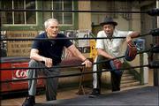 Clint Eastwood, left, and Morgan Freeman study a fighter from
ringside in the drama "Million Dollar Baby."