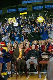 Allen Fieldhouse was louder than normal Friday morning, with
ESPN2&squot;s "Cold Pizza" broadcasting live at 7 a.m. Cane Peterson
interviewed longtime Kansas University sports broadcaster Max
Falkenstien.