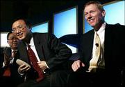 Chinese Ambassador Yang Jiechi, center, is flanked by China
Aviation Supply Company President Li Hai, left, and Boeing
Commercial Airplane President and CEO Alan Mulally, a graduate of
Lawrence High School and Kansas University. They announced Friday
that Chinese airlines have agreed to order 60 of Boeing's 787
Dreamliners in a deal that could be worth as much as $7.2 billion.