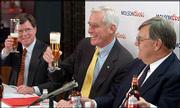 Peter Coors, center, chairman of Adolph Coors Co., shares a toast
with Bob Reese, left, chief legal officer, and Leo Kiely, who will
serve as president and CEO of Molson Coors, at the Coors Brewery in
Golden, Colo. The officials announced the merger of Coors and
Molson on Tuesday, the day Coors shareholders approved the $3.4
billion acquisition.