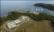 City and state officials, along with Clinton Lake neighbors and the
general public, gathered Thursday night to discuss how to hold
major events at Clinton State Park, such as the Wakarusa Music and
Camping Festival, without degrading the lake or its surroundings.
This aerial shot shows a view of the Clinton Marina with boat slips
at top and a boat storage yard at bottom left.