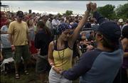 Amanda and David Van Vleet, of Roeland Park, dance to the tunes of
Sound Tribe Sector 9 at last year's Wakarusa Festival at Clinton
Lake State Park.